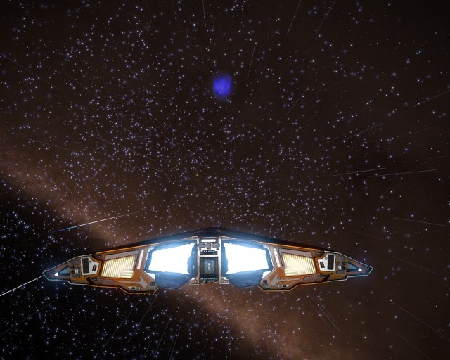A blue planetary nebula in the distance.